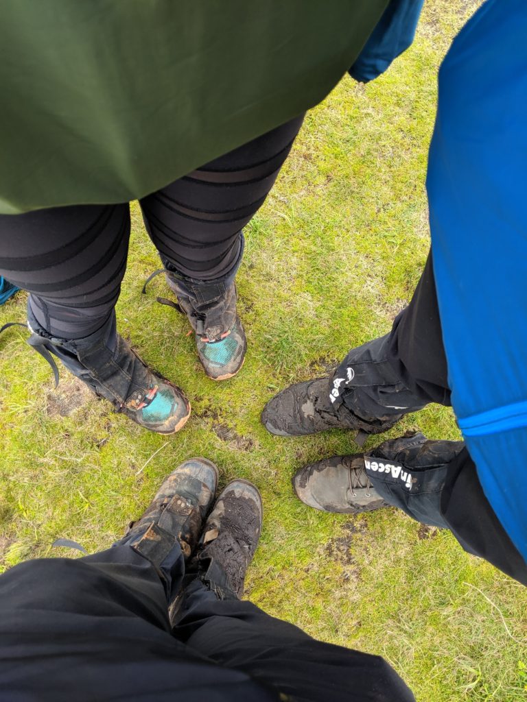 muddy boots Mt Bisoke Rwanda